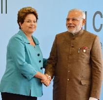 Brazilian, Indian leaders shake hands at BRICS summit