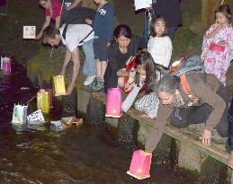 Citizens float lanterns on Potsdam river for A-bomb victims