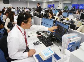 Securities firm busy as Japan Post, 2 units debut on TSE