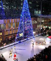 Children skate on rink made of resin panels in Toyama