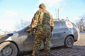 Ukraine soldier with gun guards checkpoint near Debaltseve