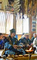 Ainu people pray to fire god in commemoration of ancestors