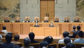 Top court gives mixed constitutionality judgments on marriage rules