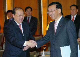 Japan, China finance ministers meet for talks on economy, yuan