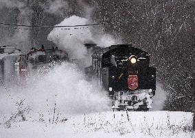 Steamer-led train runs in snow-covered northern Japan wetland
