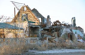 Collapsed building in war-raging eastern Ukraine