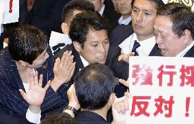 Japan's ruling camp rams security bills through Diet panel