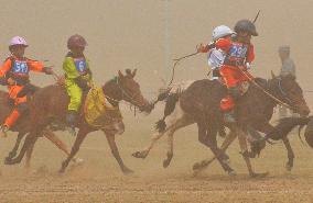 Mongolian children compete in colt race at summer sport festival