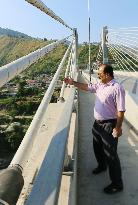 Pakistan's state official shows bridge completed with Japan's aid