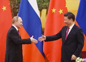 Xi welcomes Putin in Beijing