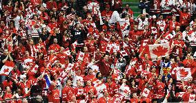 Stands in red during U.S. vs Canada match in men's ice hockey gam