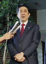 Japan to review Olympics stadium plan "from scratch": Abe