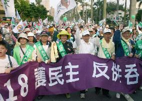 Thousands rally in Taiwan to protest China's military buildup