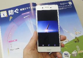 Smartphone displays defense paper image