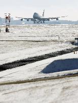 Narita runway covered by snow after 1st snowfall of the season