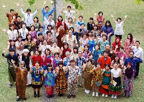 JICA staffers pose in ethnic costumes of over 30 developing nations