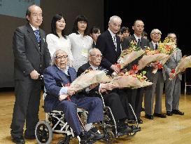 Centenarian journalist honored with belated university diploma