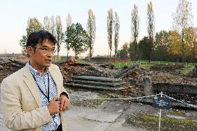 Japanese tour guide works at Auschwitz museum