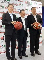 Japan basketball community leaders strike pose with single league in sight