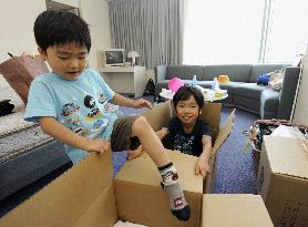 Nuclear evacuees leave closed Akasaka Prince hotel
