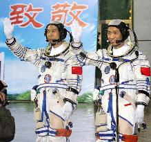 China launches 2 men into space
