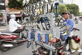 Rearview mirror street vendor in Vietnam