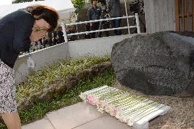 Woman prays for animals killed by 2011 disaster