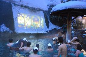 Bathers enjoy film while soaking in open-air hot spa in Tochigi, east Japan