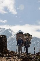 Porters on Everest Highway, tourist hotspot