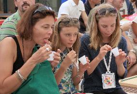 Visitors to Milan expo taste pickled Japanese apricot