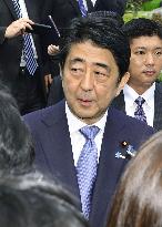 Abe visits father's grave