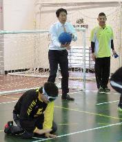 Sports agency chief tries out goalball team sport for blind in Tokyo