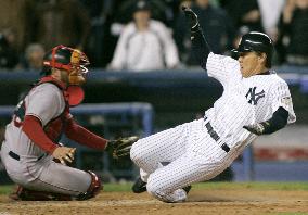 Yankees' Matsui slides home in 5th inning of game vs. Red Sox