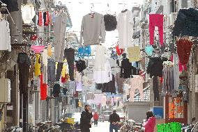 Laundry hung above Shanghai backstreets