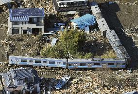 Derailed train cars on Senseki Line following 2011 disaster