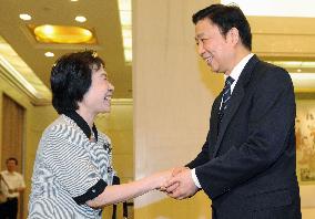 China tells Japanese war orphans friendly ties important
