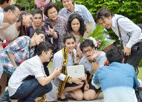 Graduating student, family member share joy at Thai university