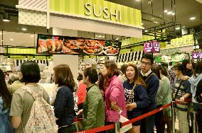 Customers swarm shopping mall in Hanoi run by Japanese retailer AEON