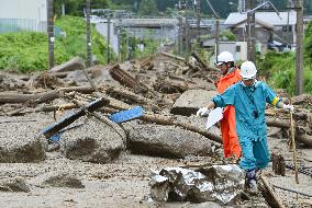 Town officials check damaged railroad track in Nagano Pref.