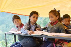 Pupils study at tent school in quake-hit Nepal