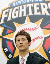 Nippon Ham ace Darvish signs 270 million yen deal