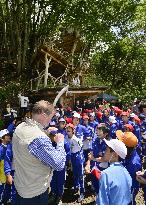 Naturalist Nicol speaks to children in open-air class