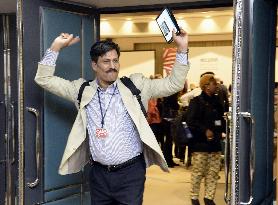 U.N. confab participant looks happy at end of protracted meeting