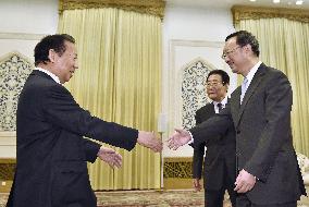 Japanese lawmaker, China's top diplomat discuss bilateral ties
