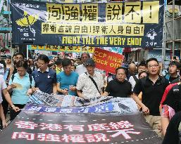 Thousands march in Hong Kong over booksellers' disappearance