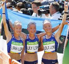 Olympic scenes: Triplet marathon runners