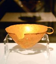 Golden cup on show at exhibition in Japan featuring German archaeologist