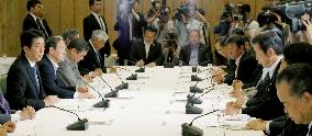 Japan's ruling bloc formally approves new security legislation