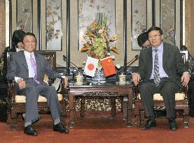 Deputy PM Aso meets China's Finance Minister Lou in Beijing