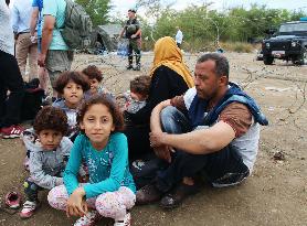 Syrian family waits in northern Greece to cross into Macedonia